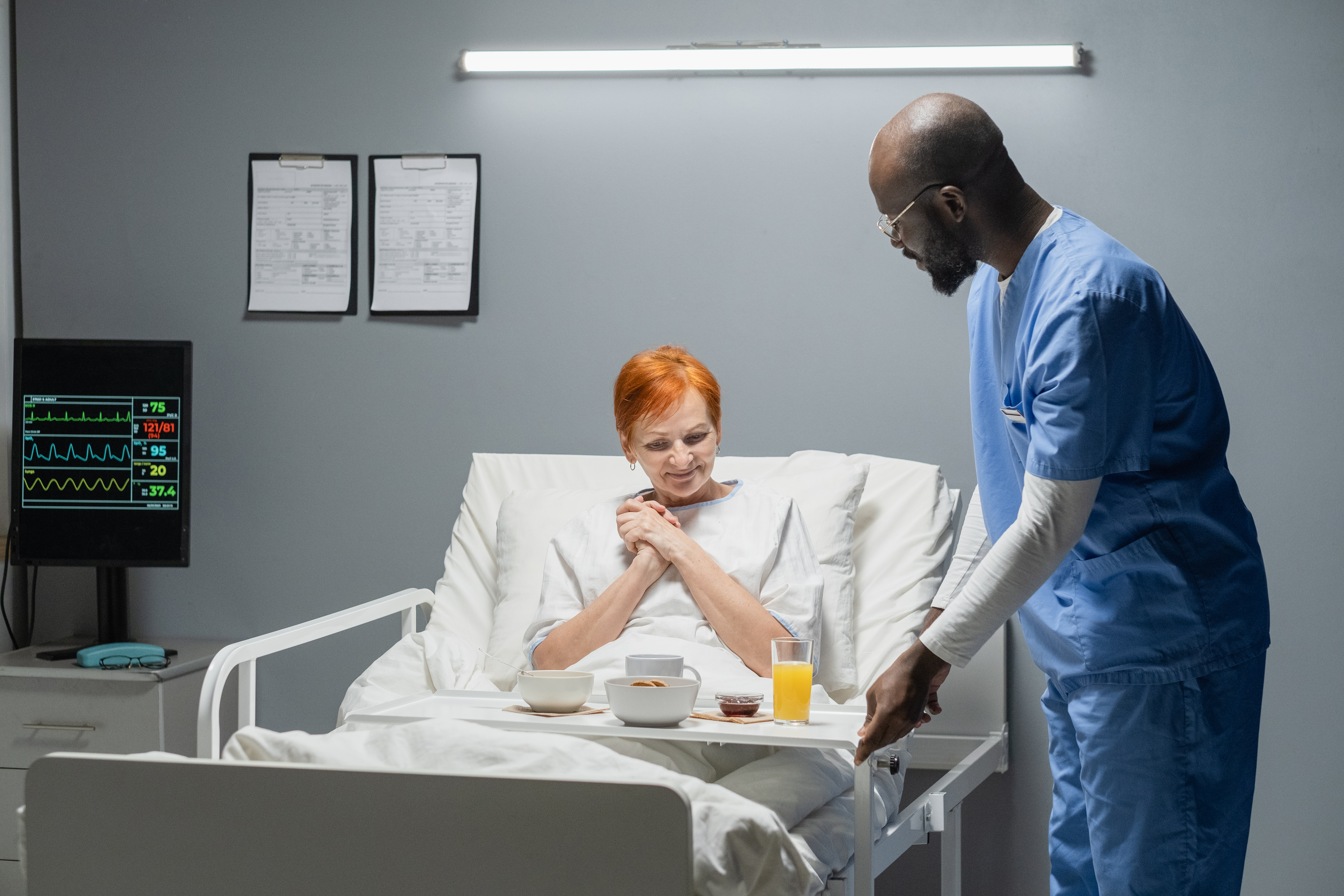 Nurse bringing breakfast for patient